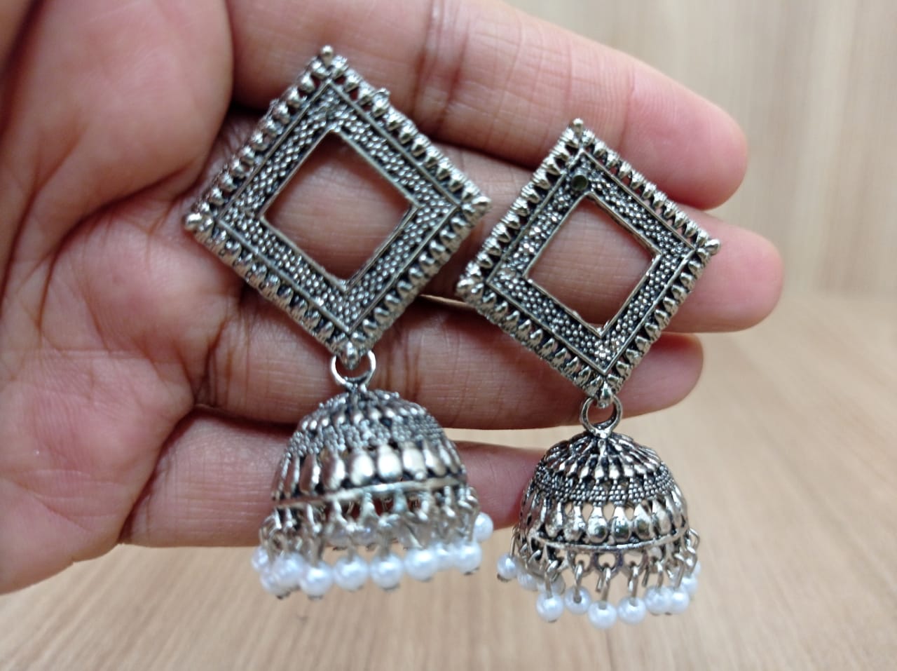 Maddy Space silver Jhumka earrings (Firozi) .